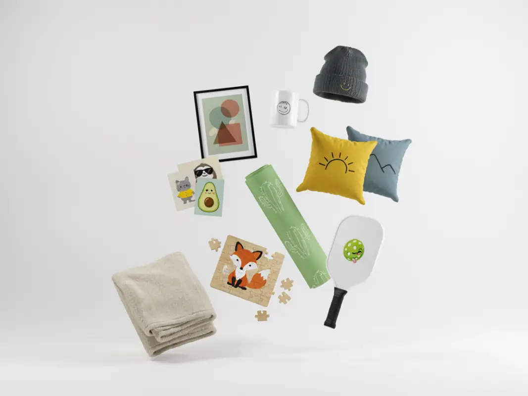 Assorted cozy home goods floating in the air: pillows, blanket, beanie, mug, framed art, postcards, a puzzle, yoga mat, and a spatula.